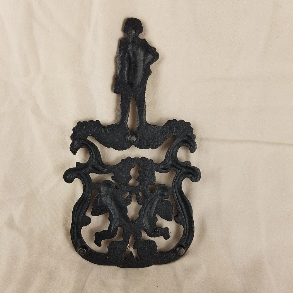 Vintage 1955 Cast Iron Trivet T-11 Cupid Sailor Cherub Black Metal Hot Plate 8.5
